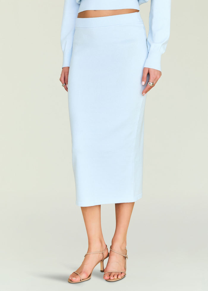 Close-up of the light blue knit midi skirt waist showing a ribbed waistband and smooth fabric.