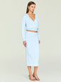 Model in pale blue knit wrap top and matching midi skirt with wrap detail and exposed midriff thumbnail image 2 of 5