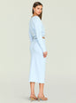Side view of a model in a pale blue reversible knit top and matching pencil skirt with a waist cutout and strappy sandals. thumbnail image 4 of 5