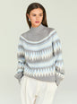 Model wearing a gray patterned knit turtleneck sweater with light blue and white bands thumbnail image 1 of 5