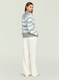 Side view of a model wearing a grey blue geometric knit Tirza sweater with a ribbed collar thumbnail image 4 of 5