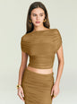 Close-up of a model wearing a tan Marsh Top with a one-shoulder draped bodice and ruching. thumbnail image 1 of 5