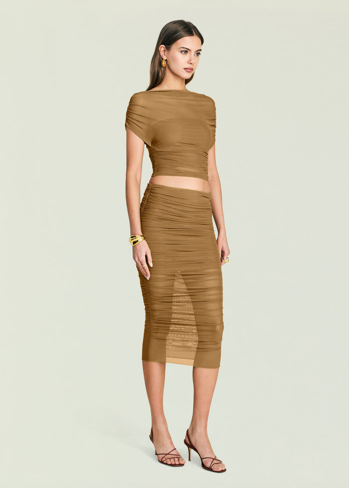 Tan Marsh Top two piece set with ruched crop top and matching midi skirt on a model.