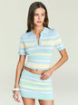 Model wearing Panie Knit Top in pale blue with pastel stripes and a polo collar. thumbnail image 1 of 5