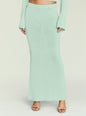 Close up of mint green knit maxi skirt showing a ribbed waistband and smooth textured fabric. thumbnail image 1 of 5