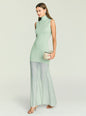 Three-quarter view of mint knit mini dress with turtleneck on a model, holding a beige handbag. thumbnail image 5 of 5