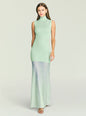Model in mint Amine knit maxi dress with sleeveless high neck and pale blue sheer overlay at the hem thumbnail image 1 of 5