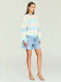 Model wearing a pastel striped knit sweater tucked into light blue denim shorts. thumbnail image 4 of 5