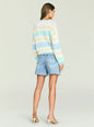 Back view of a model wearing a Cassian Sweater with pastel mint yellow and blue stripes, paired with light denim shorts thumbnail image 5 of 5