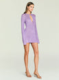 Emeri Metallic Knit Mini Dress in lavender with long sleeves and a subtle neckline cutout, paired with nude heels. thumbnail image 3 of 5