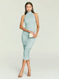 Esmee Midi Dress in teal with halter neckline and ruched figure, model holding a cream clutch. thumbnail image 5 of 5