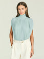 Model wearing a light blue pleated high neck Giulia Bodysuit. thumbnail image 1 of 5