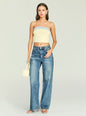 Front view of a model wearing Kiki Knit Top in pale yellow with a light blue denim trim, paired with jeans. thumbnail image 2 of 5