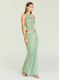 Harmony Metallic Knit Skirt set on a model in sage green, side view with halter top and matching long skirt. thumbnail image 4 of 5