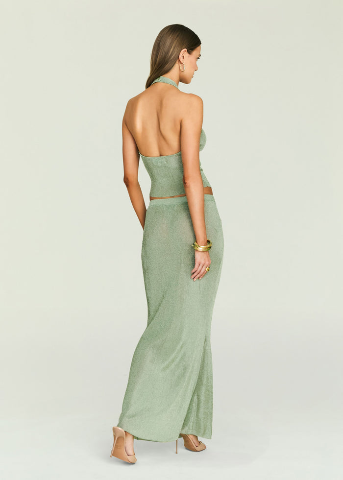 Harmony Metallic Knit Skirt back view on a model, halter top with open back and long matching skirt.