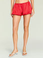 Front view of Presley Short red satin shorts on a model with an elastic waistband. thumbnail image 1 of 5