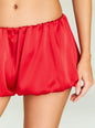 Close up of Presley Short red satin shorts waistband with elastic and gathers. thumbnail image 3 of 5