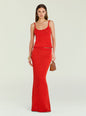 Model wearing a red knit tank top with thin straps and a matching red knit skirt, styled with gold jewelry. thumbnail image 5 of 5