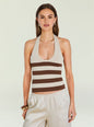 Amira Knit Tank shown on a model with a beige and brown striped halter top and layered gold necklaces. thumbnail image 1 of 6