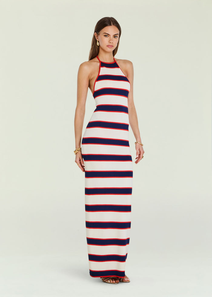 Model wearing Arrabella knit maxi dress with halter neck and nautical stripes, posing front view