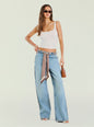 Model in white ribbed top with light wash Bond Denim Pant and a patterned belt with sunglasses thumbnail image 5 of 5