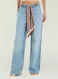 Close up of Bond Denim Pant waist with a printed scarf belt and light wash denim. thumbnail image 1 of 5