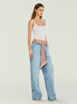Model wearing Bond Denim Pant with white tank top and a patterned scarf belt at the waist. thumbnail image 3 of 5