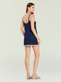 Back view of navy crochet mini dress with white trim along straps and hem thumbnail image 4 of 5