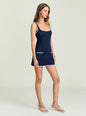 Navy crochet mini dress with white trim pockets worn by a model thumbnail image 3 of 5