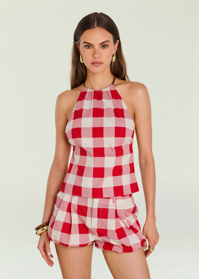 Red and pink gingham halter top on a model.
