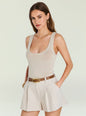 Model in a beige knit tank top with scoop neckline paired with a belt and jewelry thumbnail image 1 of 6