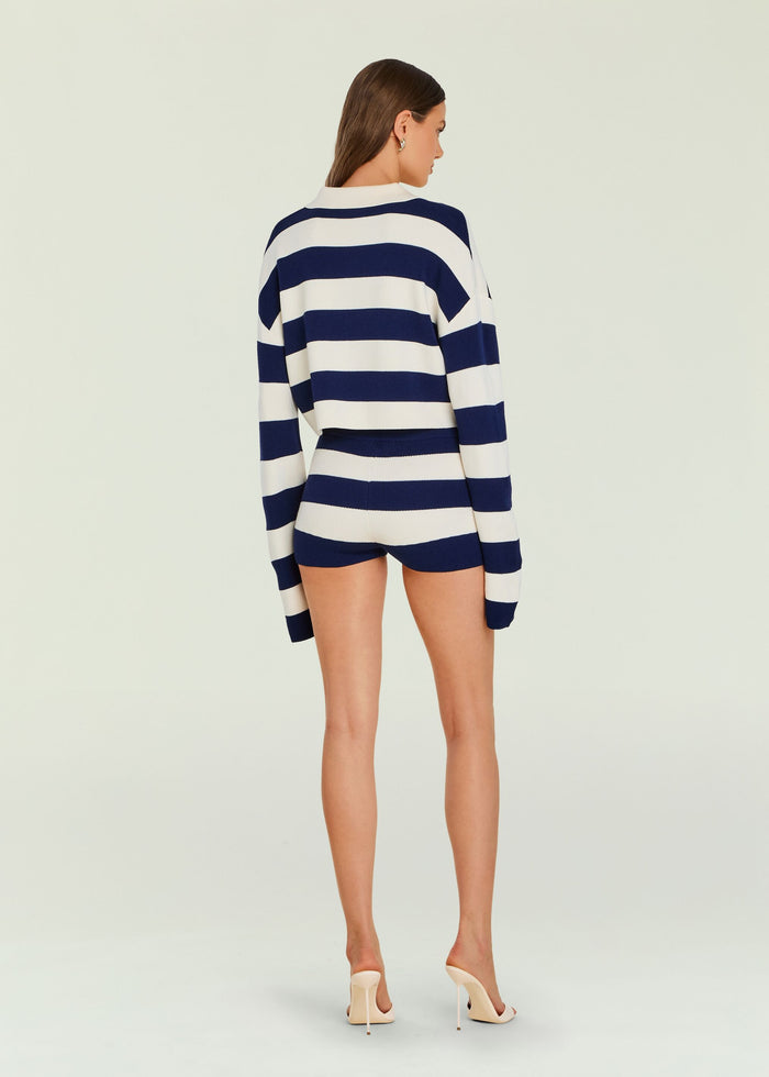 Back view of model in navy and white striped Kel Knit Hot Short set with cropped sweater and high waisted shorts