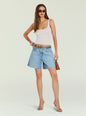 Model wearing Sabrina Boyfriend Short in light denim with a frayed hem, white ribbed tank top and belt thumbnail image 2 of 5