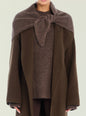 Model wearing the Amelie Scarf draped over shoulders and tied at the front with a brown knit top thumbnail image 1 of 2