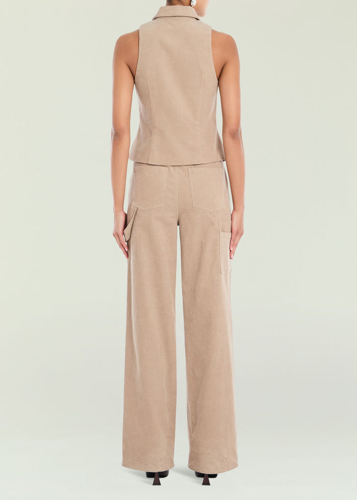 Back view of tan corduroy pants showing back pockets and a full-length wide leg fit.