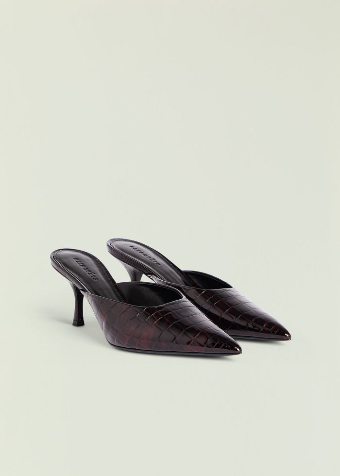 Two Bonnie Leather Mules in burgundy crocodile embossed leather with slender heels arranged together