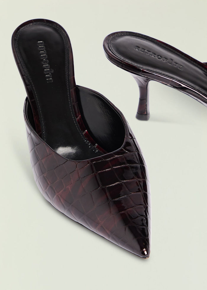 Bonnie Leather Mule close up of burgundy crocodile embossed leather with a pointed toe and slender stiletto heel