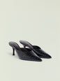 Two black crocodile-embossed Bonnie mules with pointed toes and slim heels resting on a pale background thumbnail image 5 of 5