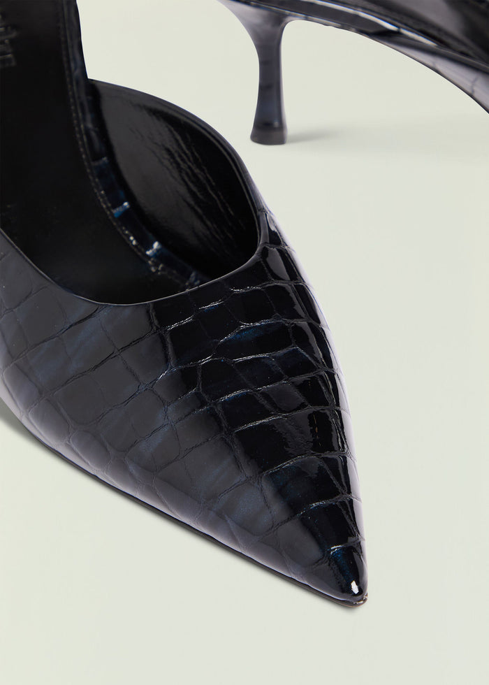 Close-up of glossy black croc-embossed Bonnie mule highlighting the pointed toe and glossy finish