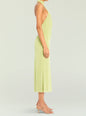 Side view of a lime green Carli Midi Dress with halter neckline and open back on a model wearing nude sandals. thumbnail image 3 of 5