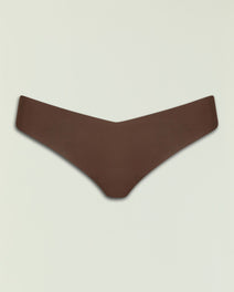 Dark brown Commando Classic Thong laid flat against a pale background.