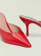 Red patent leather high heel with pointed toe and curved stiletto heel in profile thumbnail image 4 of 4