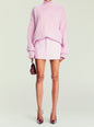 Sofia Mini Skirt styled with a soft pink oversized turtleneck sweater and a small burgundy handbag thumbnail image 5 of 6