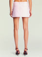 Back view of Sofia Mini Skirt in pale pink showing belt loops and rear welt pockets thumbnail image 4 of 6