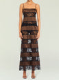 Model wearing Faye Maxi Dress in brown satin with black lace horizontal panels and thin spaghetti straps. thumbnail image 1 of 5
