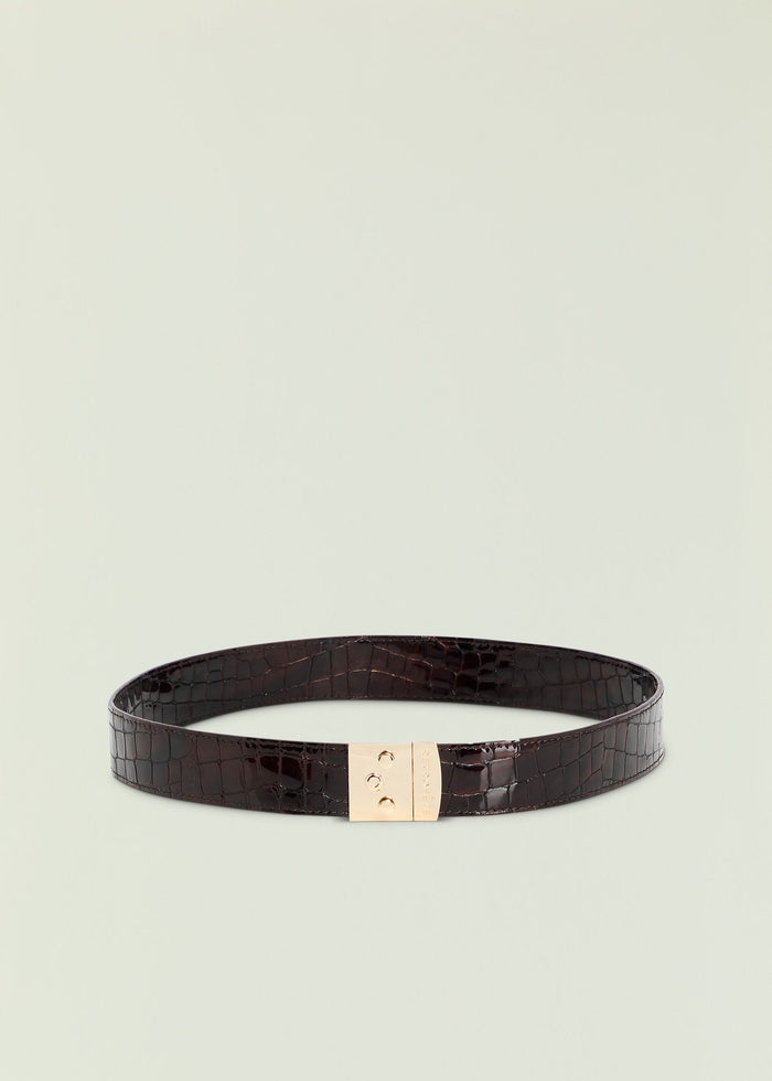 Celeste belt in dark crocodile embossed leather with a gold rectangular buckle.