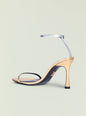 Fowla Sandal featuring a pale beige toe strap and slim metallic ankle strap on a nude stiletto heel thumbnail image 3 of 5