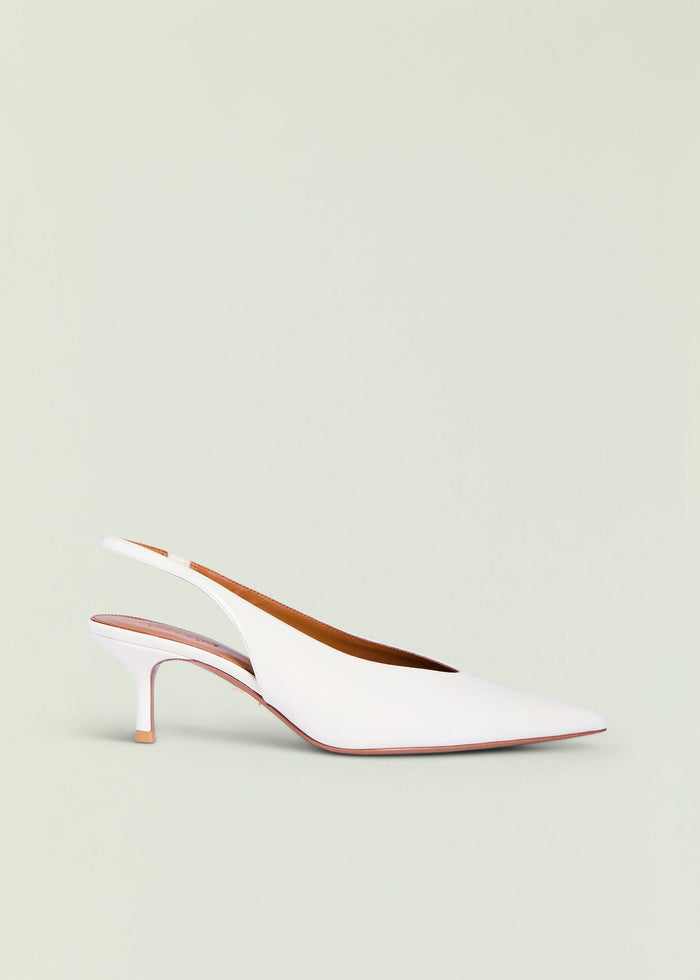Isobel Slingback Heel in white with curved strap and slim stiletto against a pale backdrop.