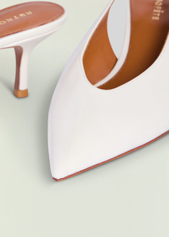 Close-up of Isobel Slingback Heel in white showing leather upper and tan insole.
