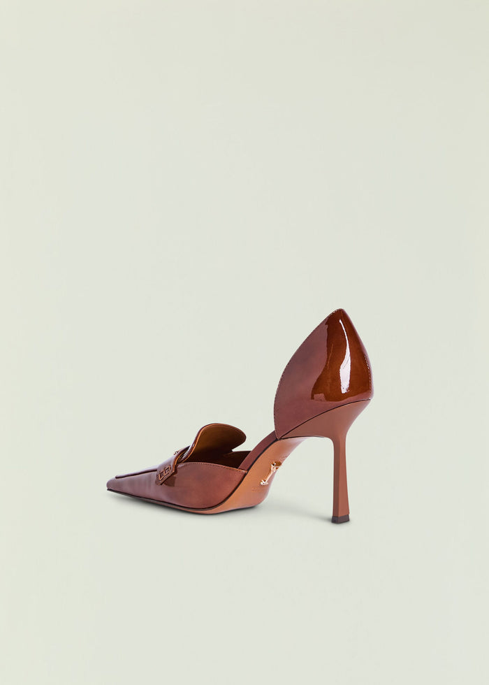 Brown patent high heel pump with a slim stiletto heel shown from the side